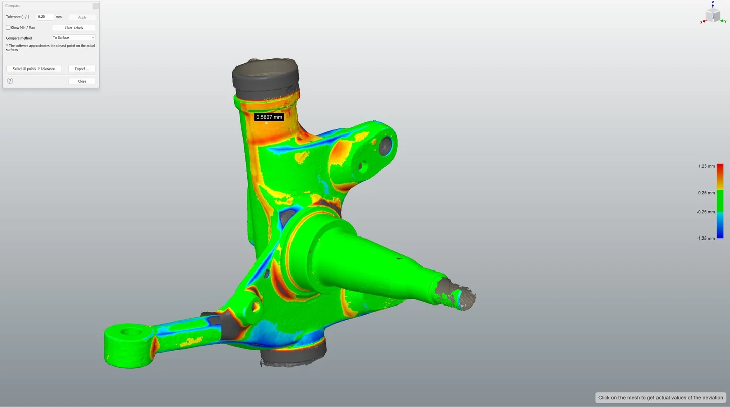 CAD-Darstellung eines Achsschenkels mit farbigem Abweichungsvergleich.